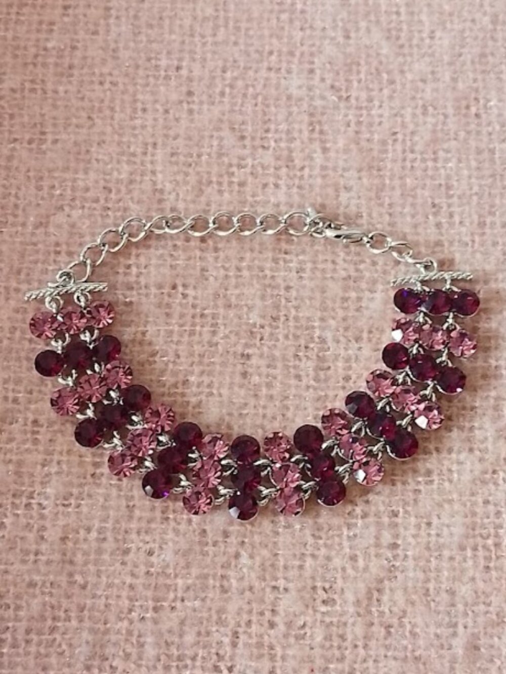 Costume Bracelet with Alternating Light and Dark Purple Reflective Stones.